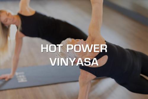 Hot Power Vinyasa - Varying and flowing sequences of postures designed to promote upper and lower body strength, balance and flexibility. Fluid cardiovascular movements are connected by your breath. Each teacher has his or her unique style. Students of all levels welcome. (95 degrees) <br><b>Click to Book Now!</b>